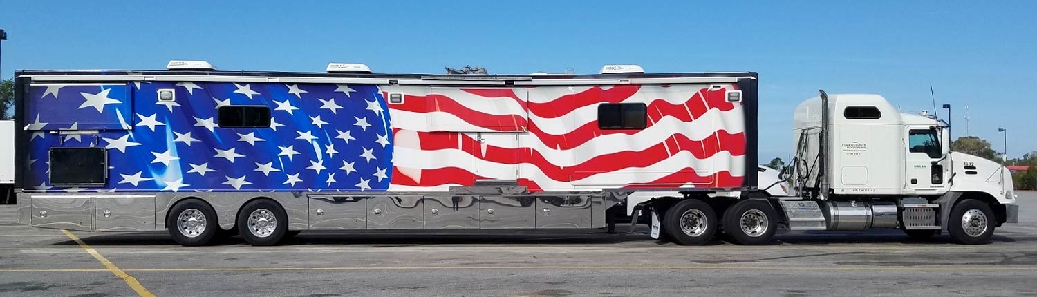White Cab with Flag Wrapped Military Trailer
